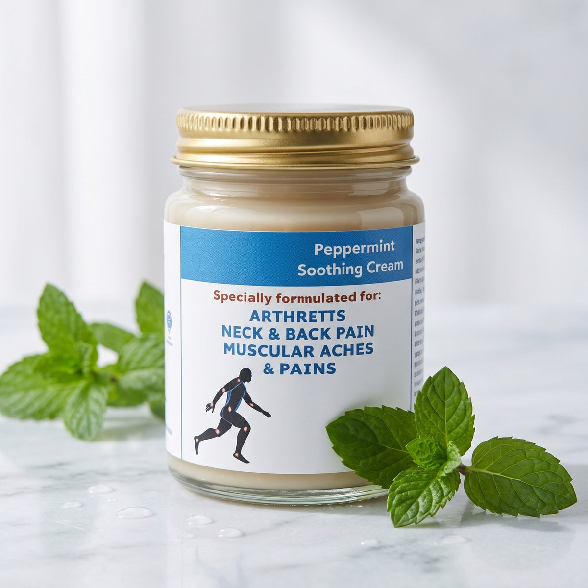 Peppermint Soothing Cream jar on marble with fresh peppermint leaves